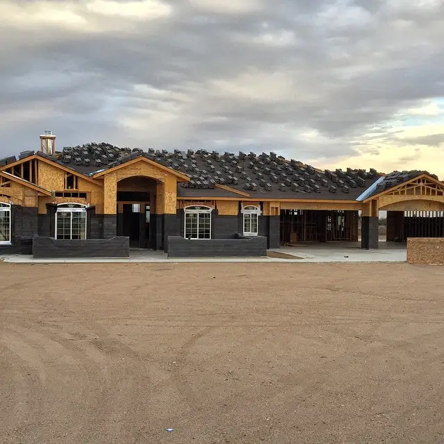 Front of a single-story stucco home built by Oak Hills Contractors